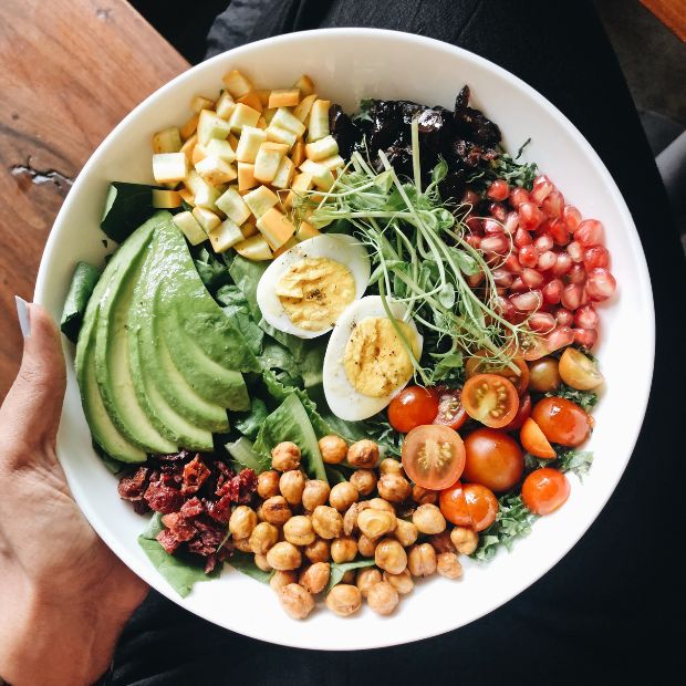 A colorful bowl of vegetables and fruits